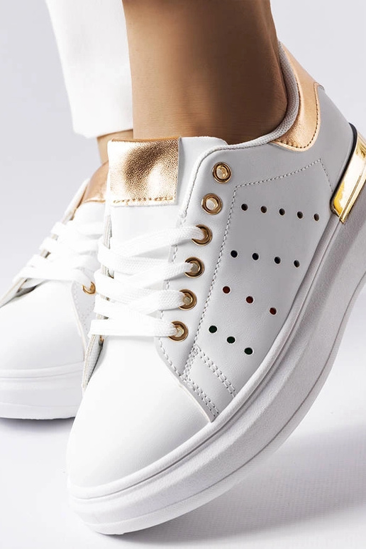 Baltas kedas ar krāsainu perforāciju...