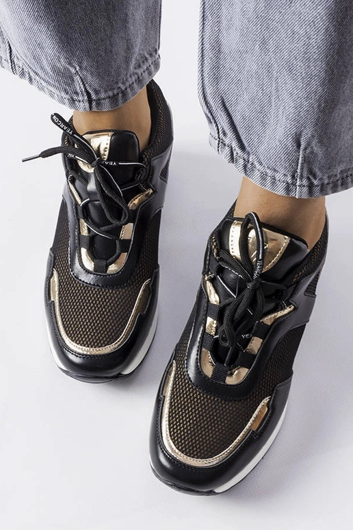 Melni-zeltaini sporta apavi uz...