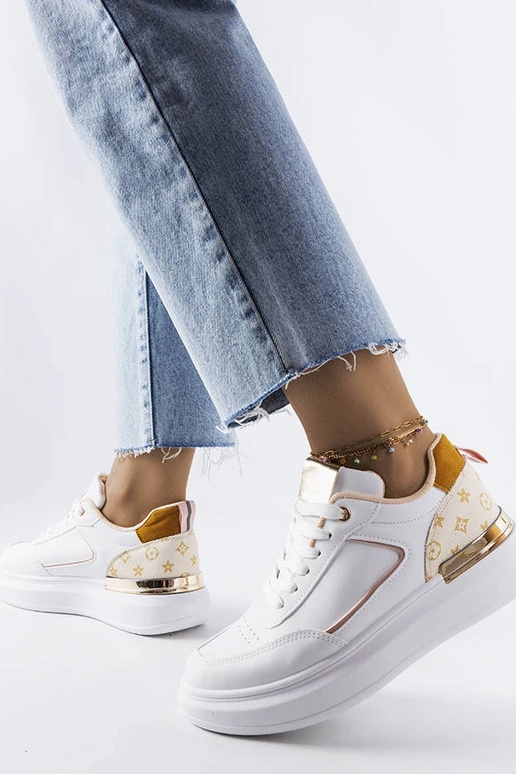 Baltas kedas ar bēšiem ieliktņiem...