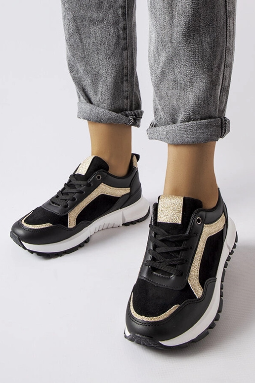 Melnas kedas ar mirdzošu rotājumu Busso