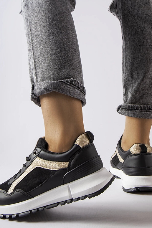 Melnas kedas ar mirdzošu rotājumu Busso