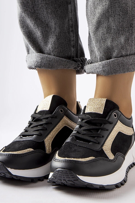 Melnas kedas ar mirdzošu rotājumu Busso