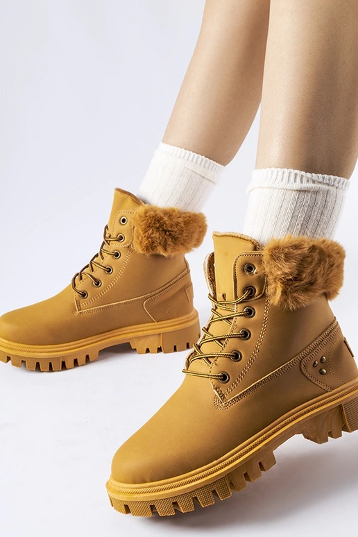 Brūni zābaki ar dekoratīvu kažokādu...