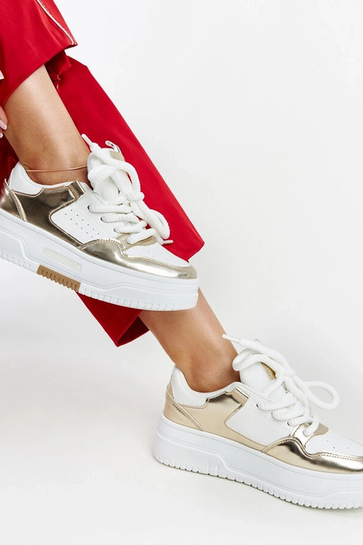 Baltas un zelta krāsas Farkas kedas...