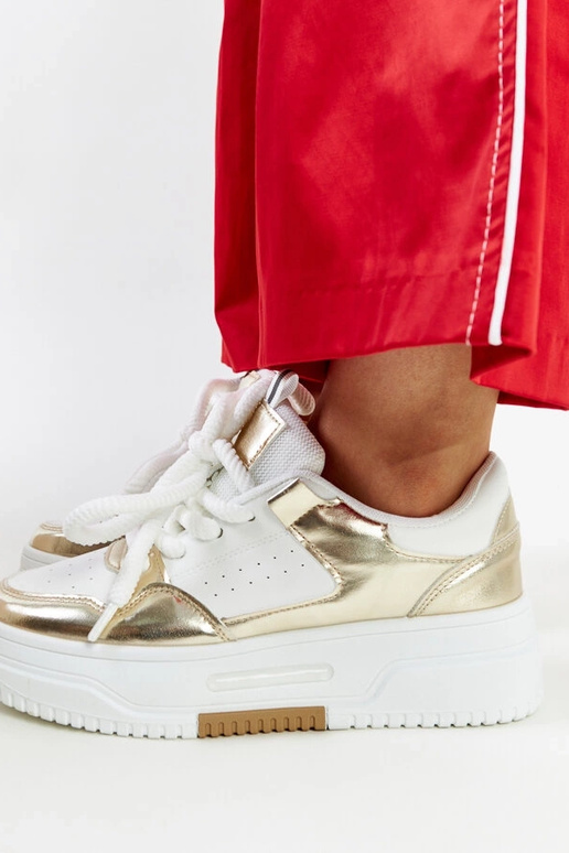 Baltas un zelta krāsas Farkas kedas...