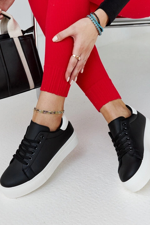 Melnbaltas kedas ar biezu zoli Ruta