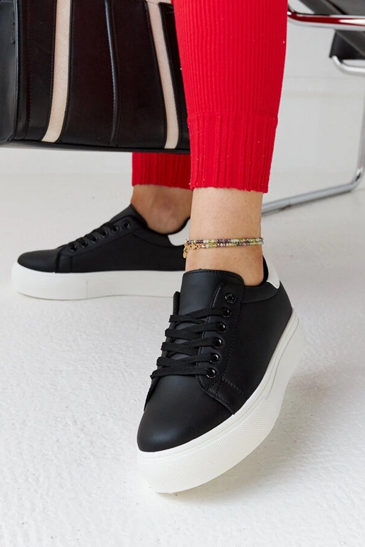 Melnbaltas kedas ar biezu zoli Ruta