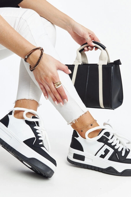 Melnbaltas kedas ar biezu zoli Galit