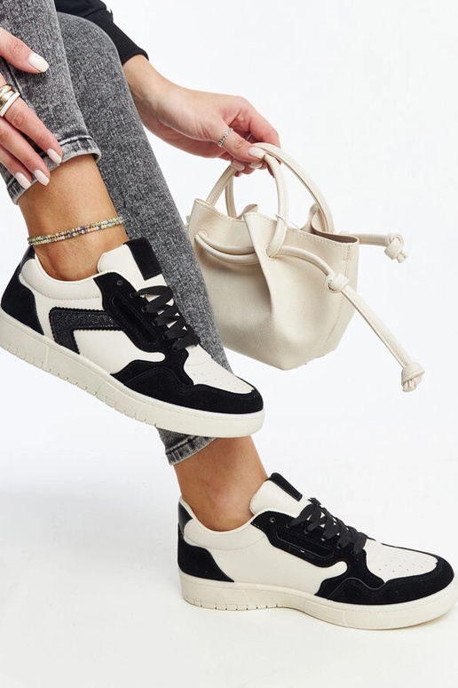 Juwan melnas un baltas mirdzošas kedas