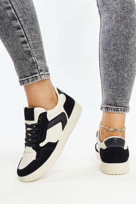 Juwan melnas un baltas mirdzošas kedas