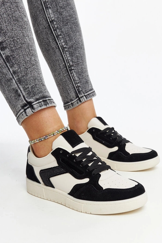 Juwan melnas un baltas mirdzošas kedas