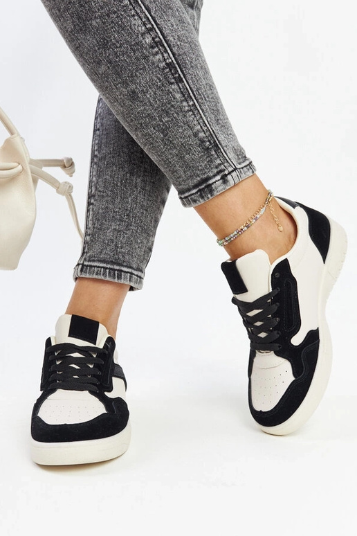 Juwan melnas un baltas mirdzošas kedas