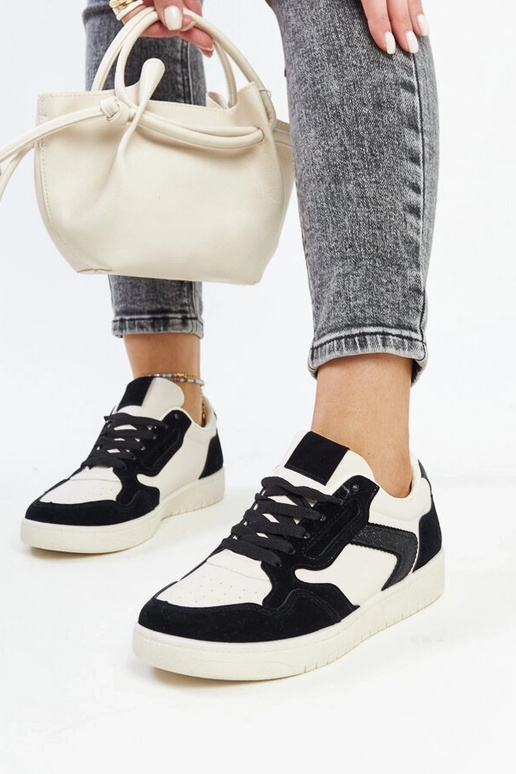 Juwan melnas un baltas mirdzošas kedas