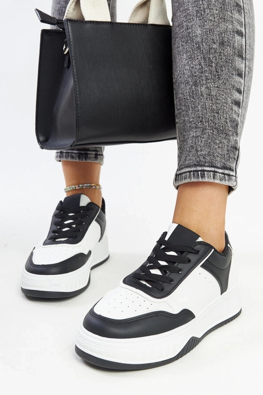 Melnbaltas kedas ar biezāku zoli Rumai