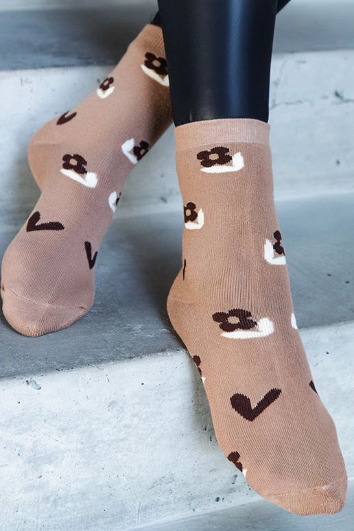 Melnbaltas siltās zeķes Sella