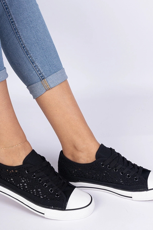 Melni sieviešu caurumiņapavi