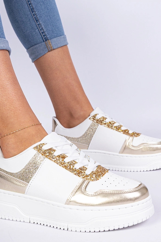 Zelta sieviešu sneakers ar biezu zoli Zelta sieviešu sneakers ar biezu zoli