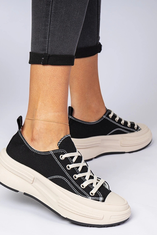 Melni sieviešu auduma sporta apavi...