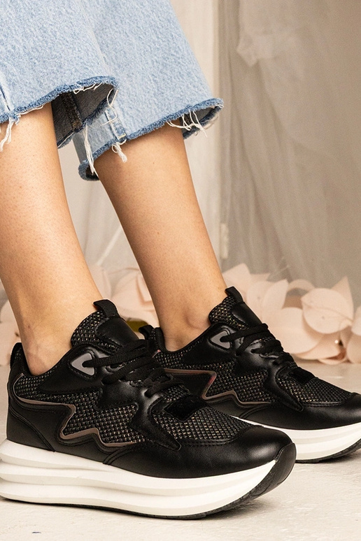 Melnas kedas ar hologrāfisku elementu...