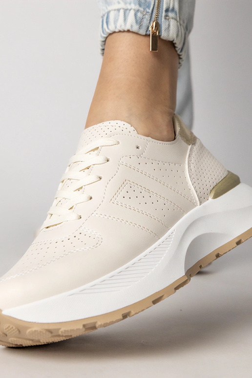 Smilšu krāsas sporta apavi ar zelta...