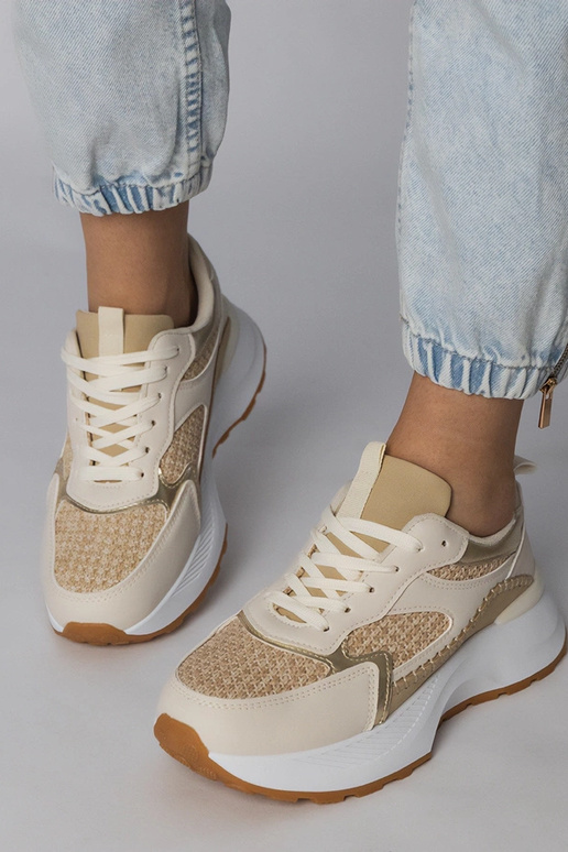 Smilšu krāsas sporta apavi ar pinuma...