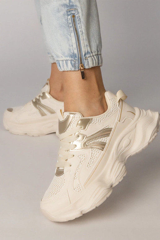 Smilšu krāsas sieviešu sporta apavi...