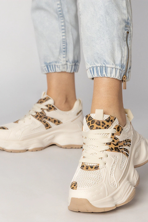 Smilšu krāsas sieviešu sporta apavi...