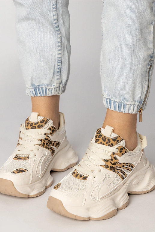 Smilšu krāsas sieviešu sporta apavi...