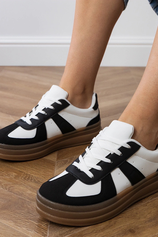 Melni sieviešu sporta apavi uz...