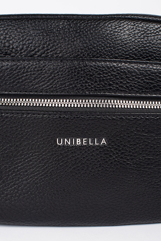 Tā irz melns eleganta rokassomiņa uz...