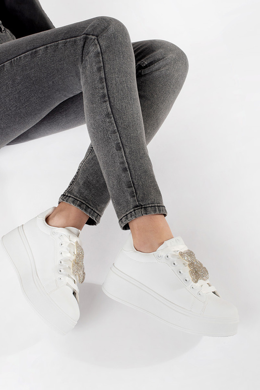 baltas krāsas sporta apavi ar platformu