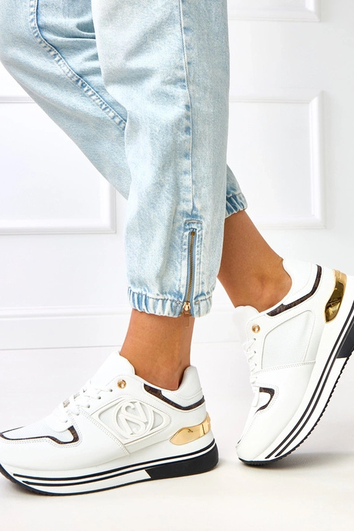 Balti-melni sporta apavi uz... Balti-melni sporta apavi uz...