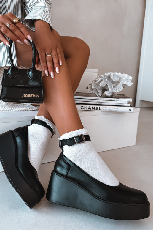 Sieviešu melnas krāsas kurpes uz platformas ar jostām Belvissa