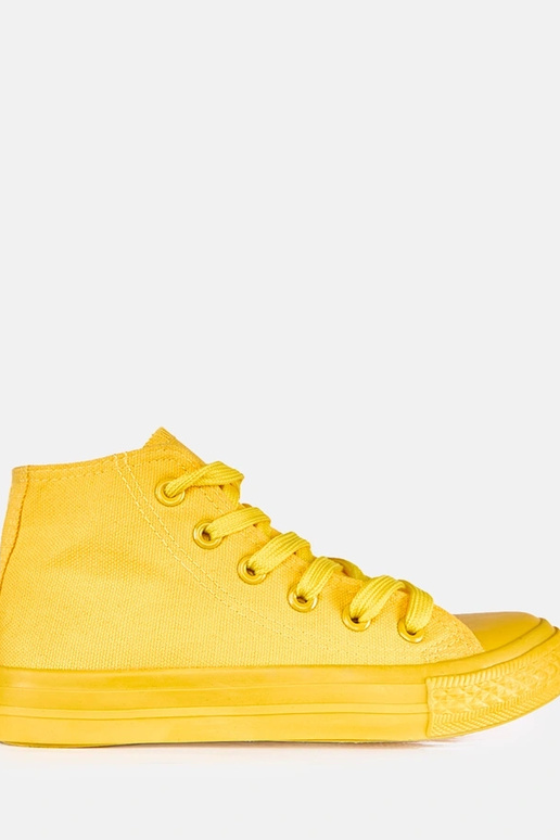 Dzelteni bērnu sporta apavi virs...