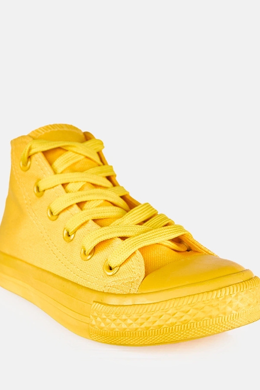 Dzelteni bērnu sporta apavi virs...