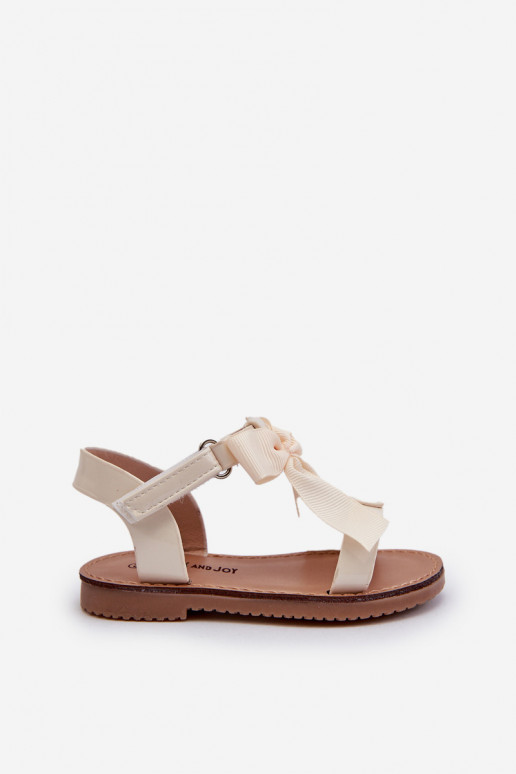 Lakotas sandales Bērnu apavi ar bantītēm ar lipīgām aizdarēm Ziloņkaula krāsas Joratia