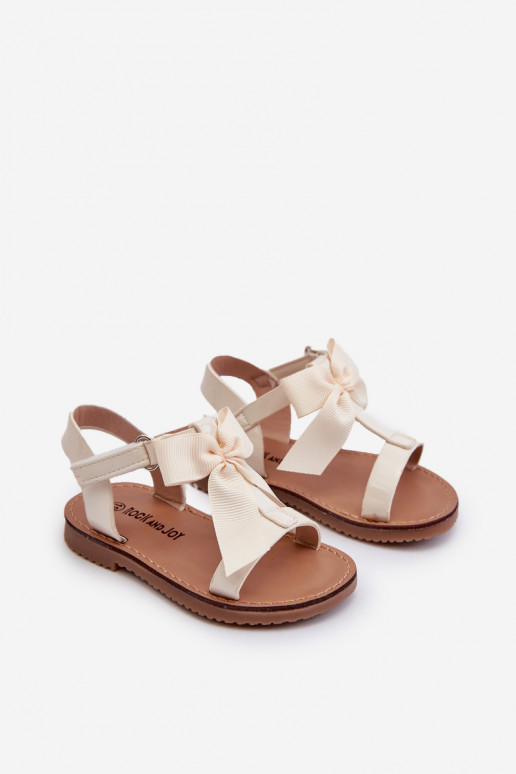 Lakotas sandales Bērnu apavi ar bantītēm ar lipīgām aizdarēm Ziloņkaula krāsas Joratia