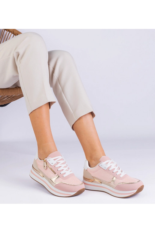 Rozā sporta kedas uz platformas ar...