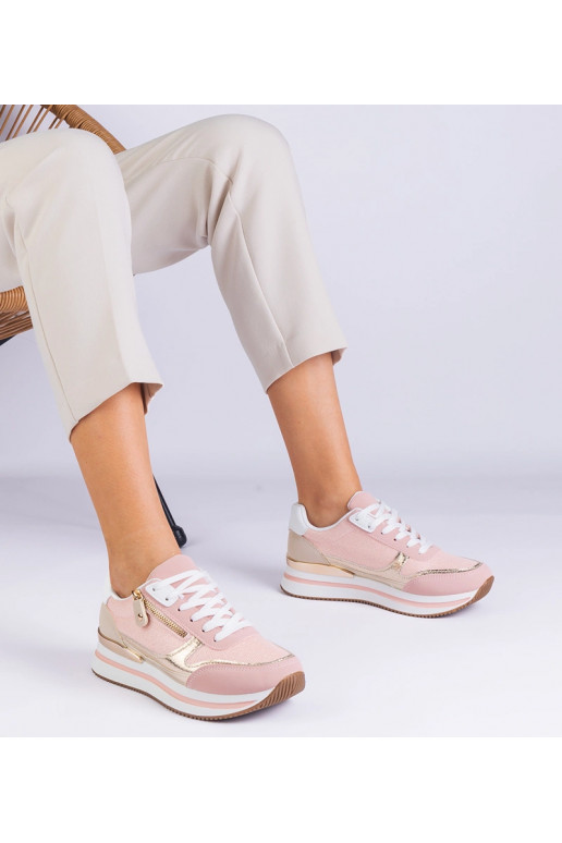 Rozā sporta kedas uz platformas ar...